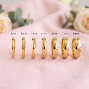 Par de alianzas de boda media caña en Oro 18k hechas a mano bajo pedido