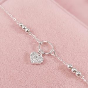 Pulsera de cadena en Plata 925 con aro central, dije de corazón con zirconias y esferas de plata